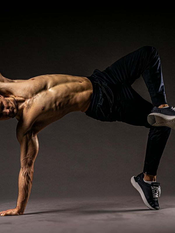 Athletic man in a dynamic pose showing strength and control.